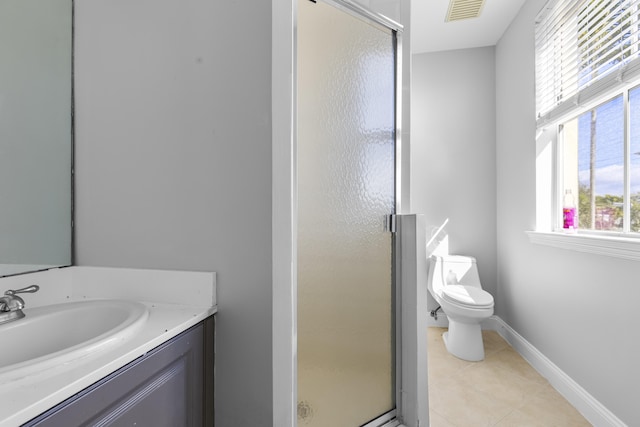 bathroom with an enclosed shower, vanity, tile patterned flooring, and toilet