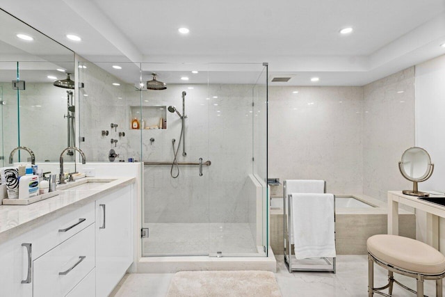 bathroom featuring vanity and walk in shower