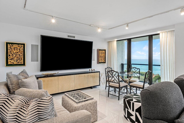 living room featuring rail lighting