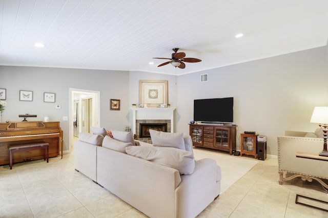 living room with a fireplace, vaulted ceiling, ceiling fan, wooden ceiling, and light tile patterned floors