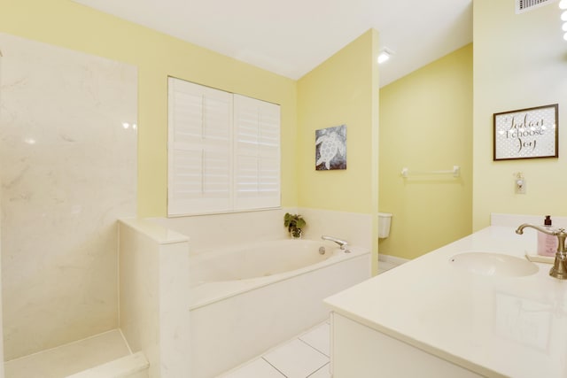 bathroom featuring toilet, a bathtub, tile patterned floors, and vanity