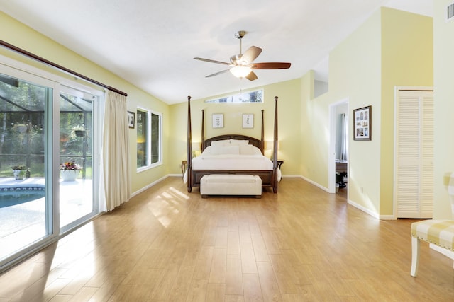 unfurnished bedroom with lofted ceiling, access to exterior, ceiling fan, and light hardwood / wood-style flooring