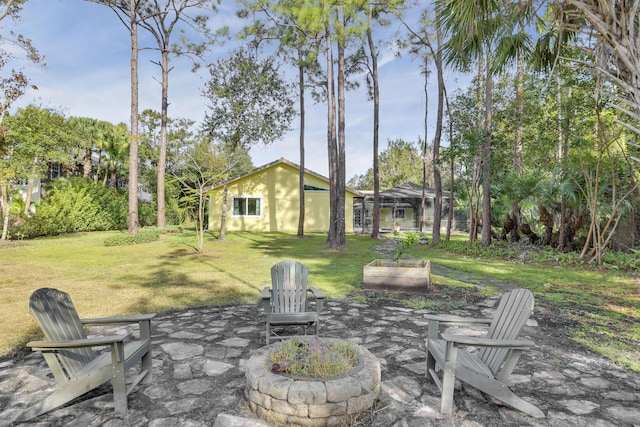 view of patio / terrace featuring an outdoor fire pit