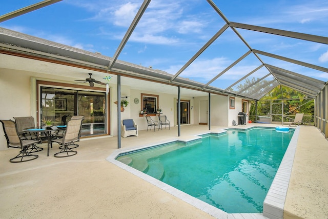 view of swimming pool featuring a patio area, a lanai, and area for grilling