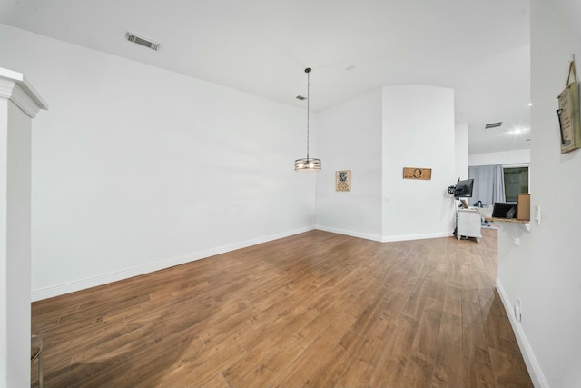 unfurnished living room with hardwood / wood-style flooring