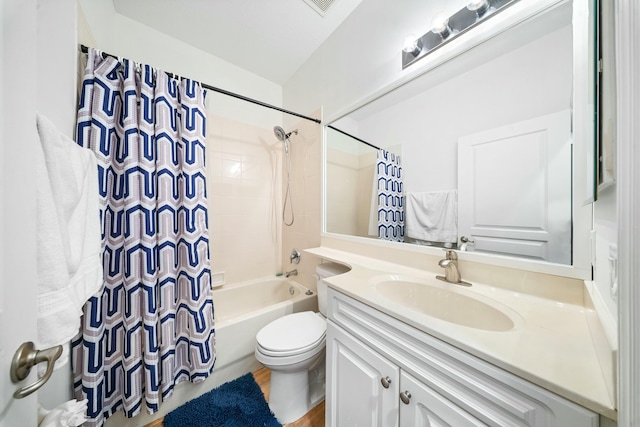 full bathroom with toilet, vanity, and shower / bath combo with shower curtain