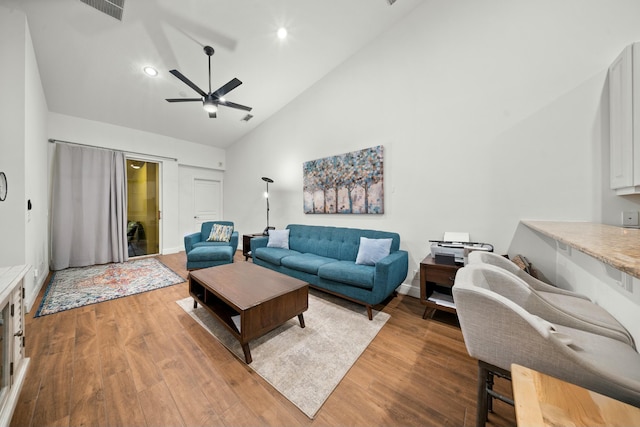 living room featuring ceiling fan, hardwood / wood-style floors, and high vaulted ceiling