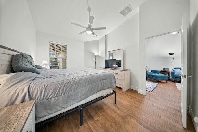 bedroom with ceiling fan and light hardwood / wood-style floors