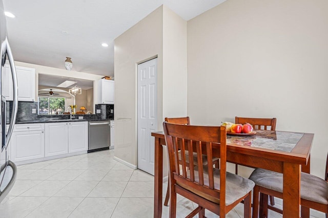 tiled dining area featuring sink