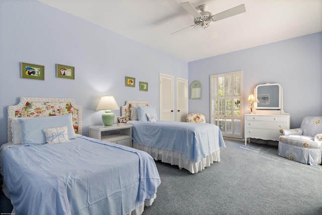 bedroom featuring ceiling fan and carpet