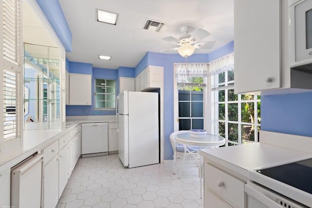 kitchen featuring white cabinets, ceiling fan, white appliances, and light tile patterned floors