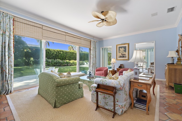 tiled living room with ceiling fan and ornamental molding