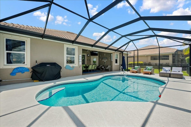 view of pool featuring a patio, outdoor lounge area, area for grilling, and a lanai