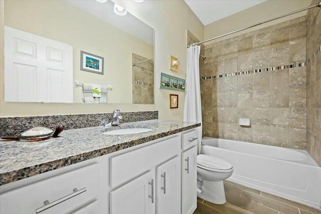 full bathroom with vanity, shower / bath combo, and toilet