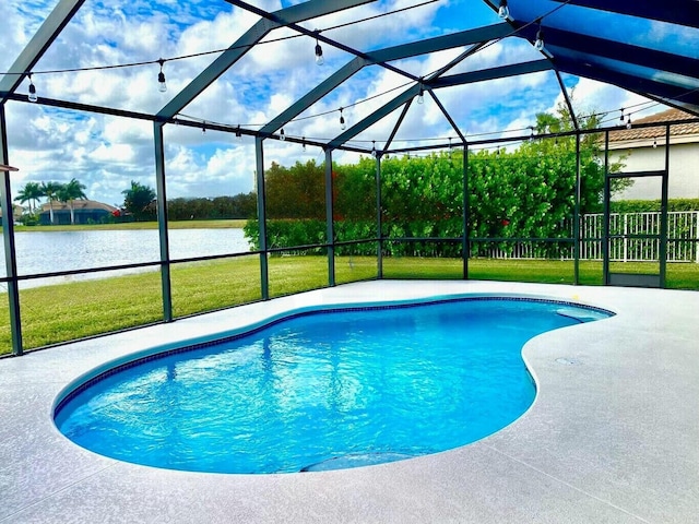 view of pool with a water view, a patio, glass enclosure, and a lawn