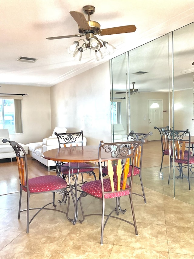 dining room featuring ceiling fan and light tile patterned floors