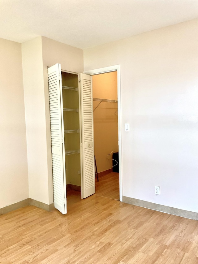 unfurnished bedroom with light hardwood / wood-style flooring