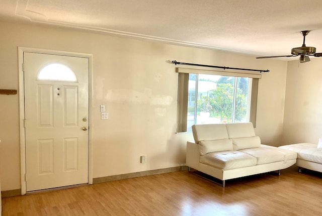 entrance foyer featuring hardwood / wood-style flooring and ceiling fan