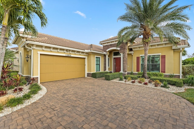 mediterranean / spanish house featuring a garage