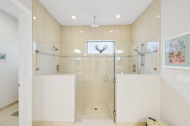 bathroom featuring an enclosed shower and tile patterned flooring