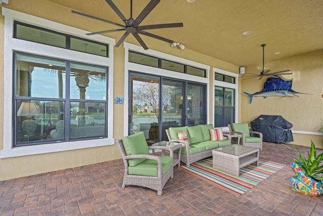 view of patio / terrace with grilling area, an outdoor hangout area, and ceiling fan