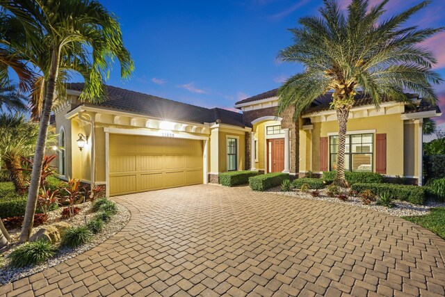 mediterranean / spanish house featuring a garage