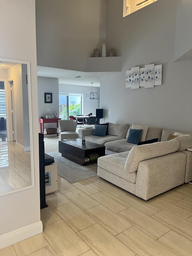 living room with a towering ceiling