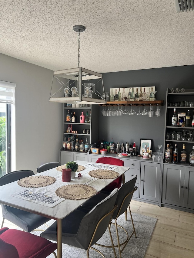 dining room featuring a textured ceiling