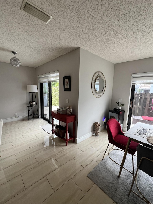 dining area with a textured ceiling