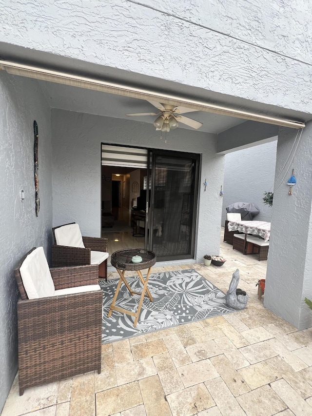 view of patio / terrace featuring ceiling fan