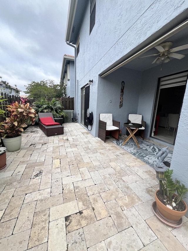 view of patio featuring ceiling fan