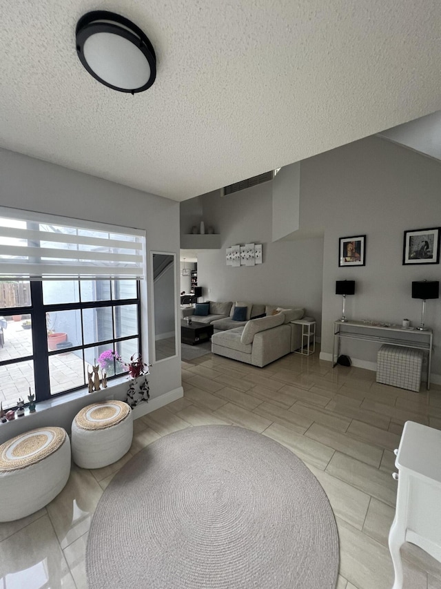 living room with a textured ceiling