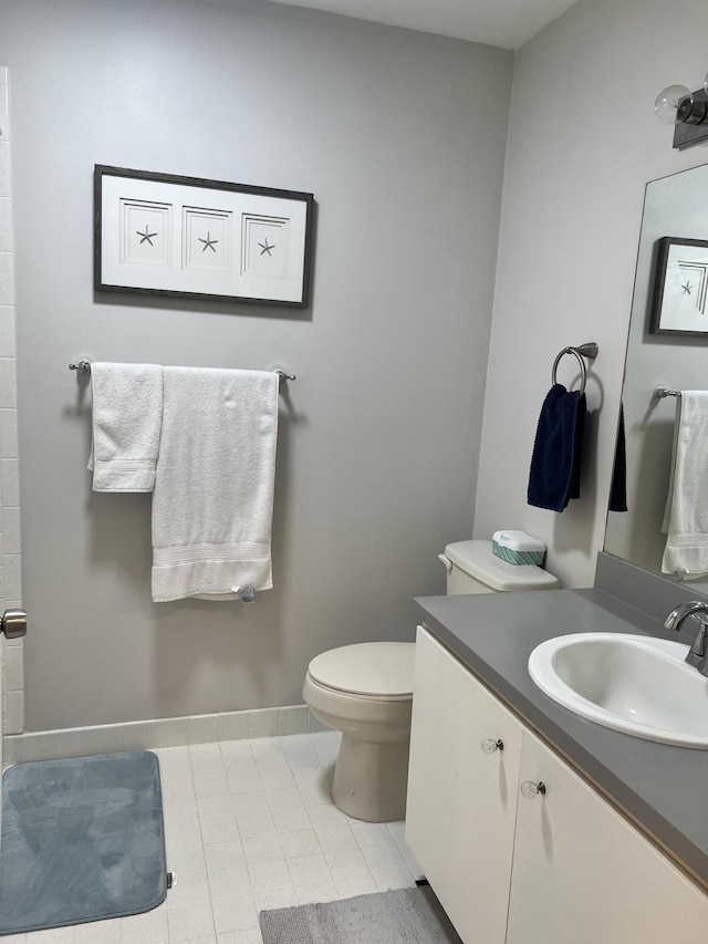 bathroom with toilet and vanity