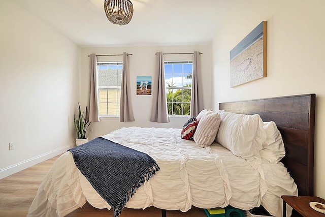 bedroom with hardwood / wood-style flooring