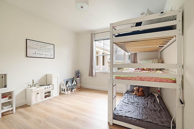 bedroom with light wood-type flooring