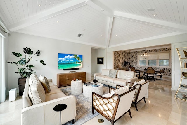 living room with beam ceiling and a notable chandelier