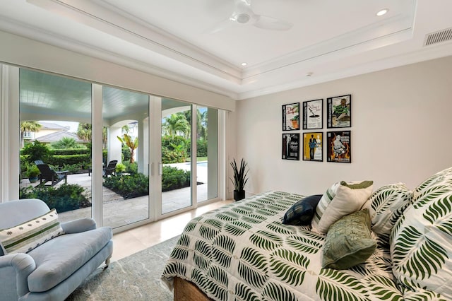 bedroom with a raised ceiling, french doors, ceiling fan, and access to exterior