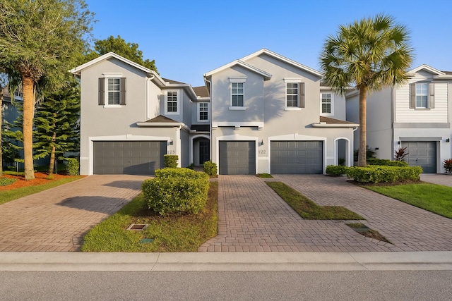 5138 White Oleander, West Palm Beach, FL 33415 - view of front of property featuring an attached garage, stucco siding, and driveway