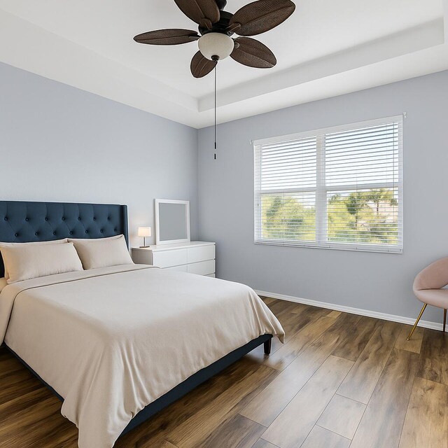 5138 White Oleander, West Palm Beach, FL 33415 - bedroom featuring a raised ceiling, baseboards, dark wood-type flooring, and a ceiling fan