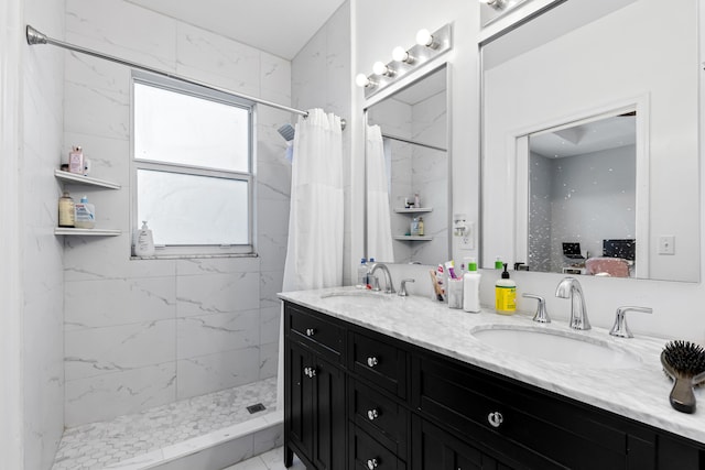 bathroom featuring vanity and curtained shower