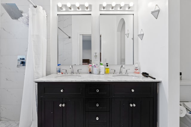 bathroom with vanity and a shower with shower curtain