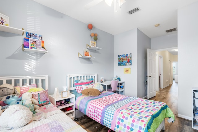 bedroom featuring dark wood-type flooring and ceiling fan