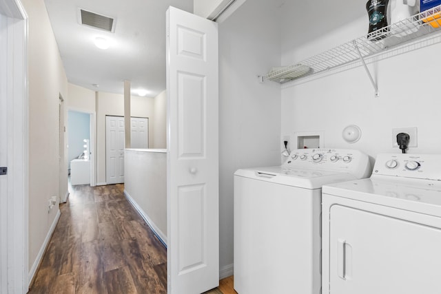 laundry area featuring dark hardwood / wood-style flooring and independent washer and dryer