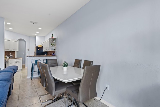 dining room featuring light tile patterned flooring