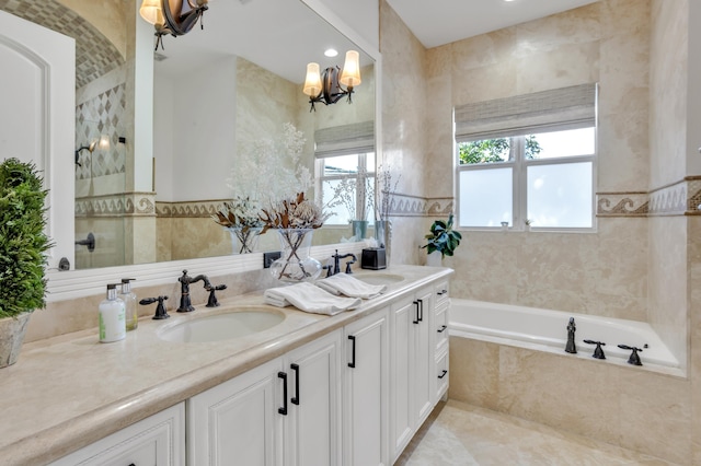 bathroom with independent shower and bath, vanity, tile walls, and an inviting chandelier