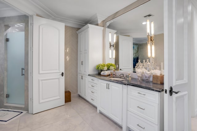 bathroom with ornamental molding and vanity