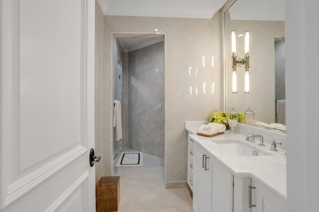 bathroom featuring vanity, tile patterned floors, and crown molding