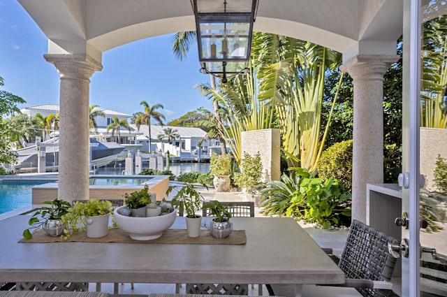 view of patio with a water view