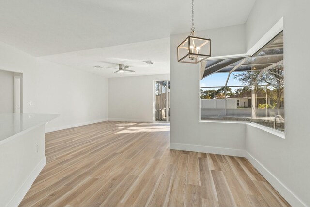 unfurnished bedroom featuring ceiling fan, a closet, and light hardwood / wood-style flooring