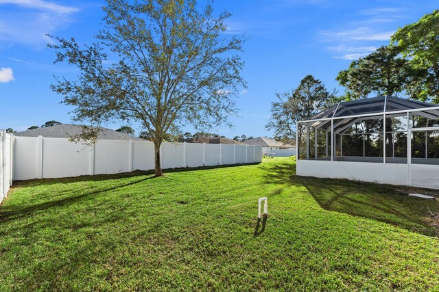 view of yard featuring a lanai